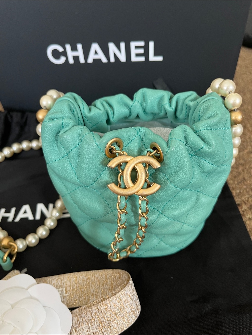 CHANEL Tiffany Blue Quilted Lambskin Mini Drawstring Bucket Bag with Pearl Chain